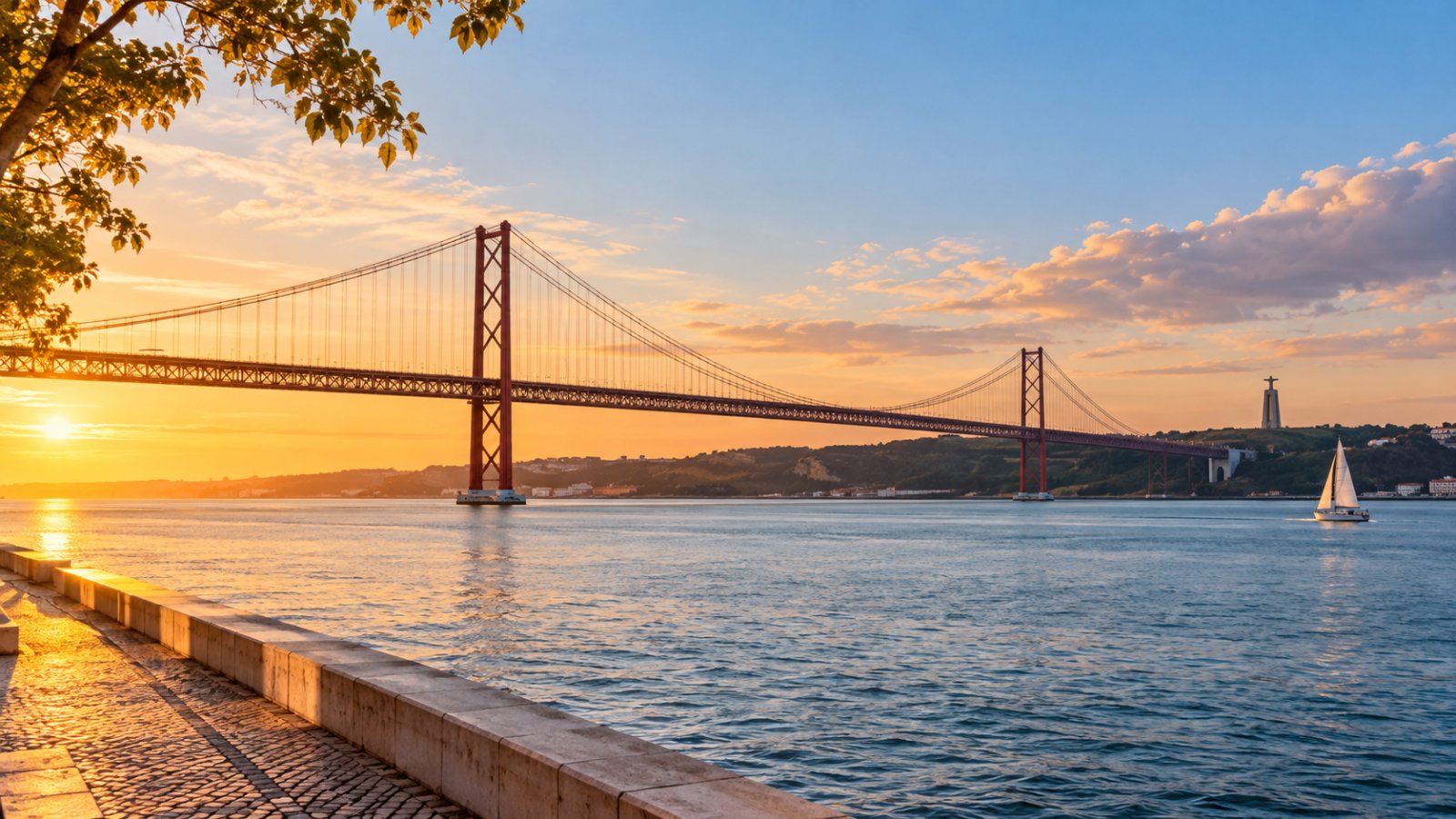 View of the 25 de Abril bridge over the Tagus at sunset, near Giola Belém