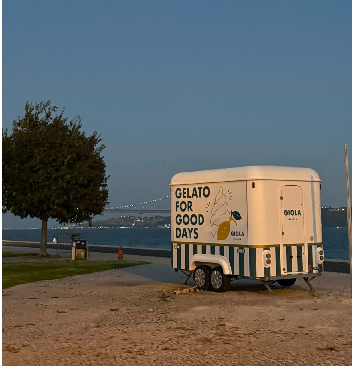 GIOLA Belém trailer by the river at dusk